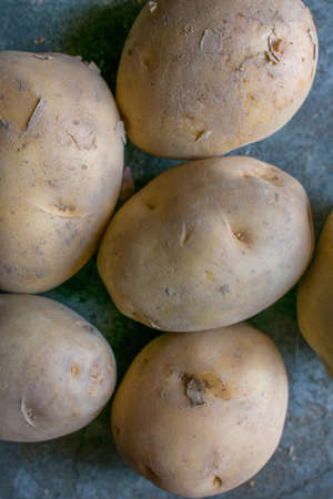 A lots of potatoes in the kitchen with selective focus.の写真素材