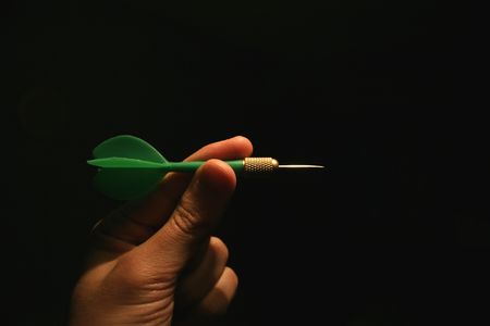 holding a green arrowの写真素材