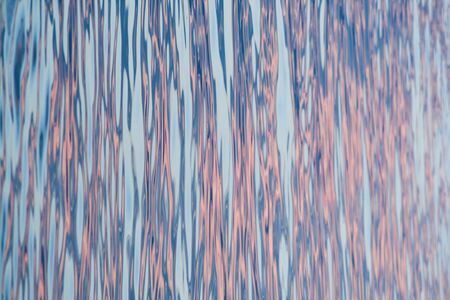 sea and some colourful reflections on itの写真素材