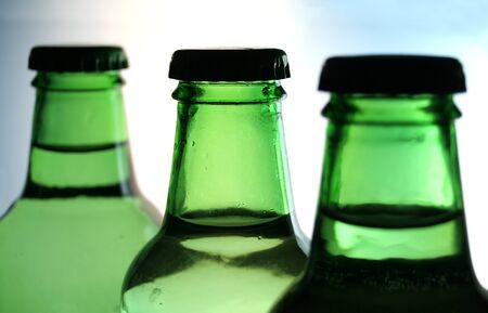 three green botles in lineの写真素材
