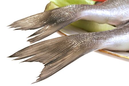 close-up shot swowing two fish2s tail on a plateの写真素材