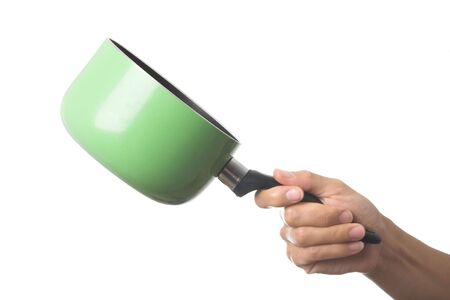 image of a hand holding a green panの写真素材