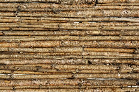 wooden sticks lined up ideal as backgroundの写真素材