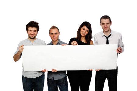 young people holding a blank banner studio shot on whiteの写真素材