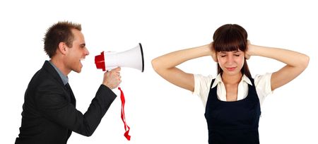 young businessman shooting at  a businesswomans  with a megaphoneの写真素材