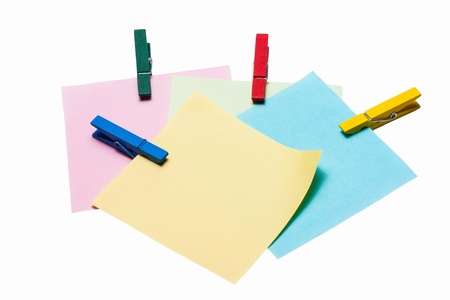 reminder note on color clothes pins on white background