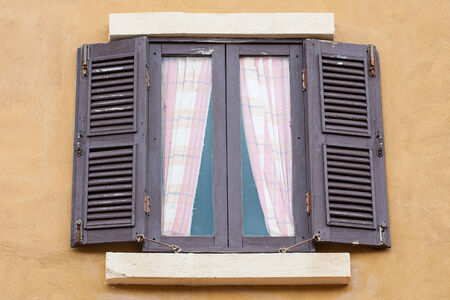 Old wood window on concrete wall の写真素材