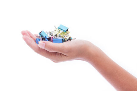 hand holding colorful binder clipsの写真素材