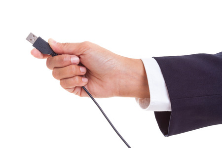 Businessman hand holding USB cable の写真素材