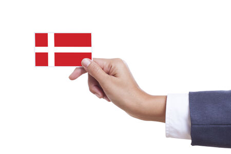 Businessman holding a business card with Denmark Flag with using path の写真素材