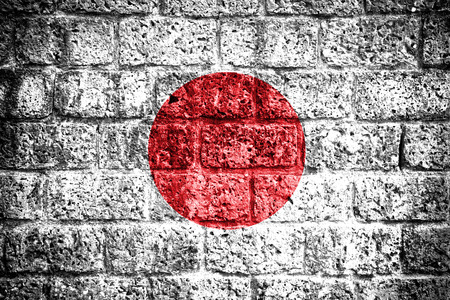 Grunge Japan flag on brick wall の写真素材