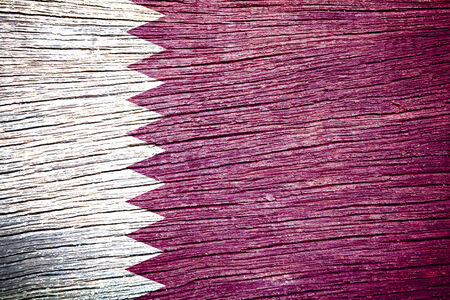 Qatar Flag painted on old wood texture の写真素材