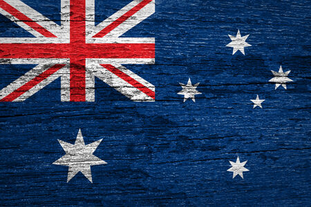 Australia Flag painted on old wood plank background の写真素材