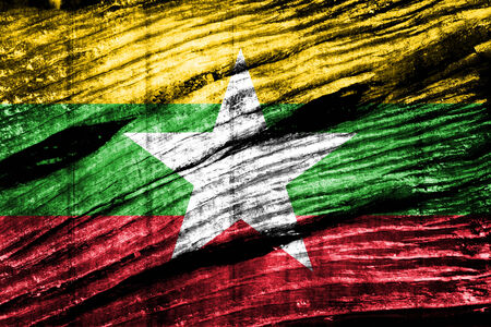 Myanmar flag on old wood texture の写真素材