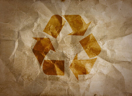 Recycle logo on crumpled paper の写真素材