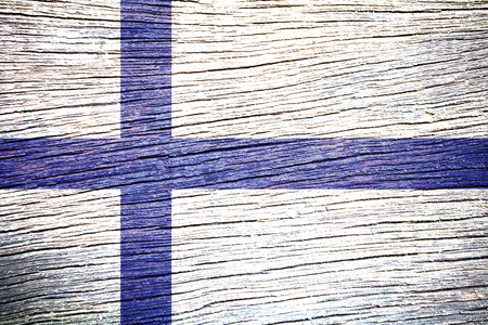 Finland Flag painted on old wood background の写真素材
