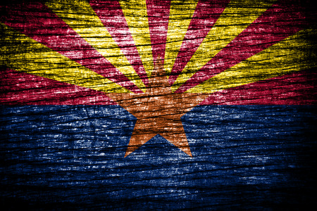 Flag of Arizona painted on old wood background の写真素材