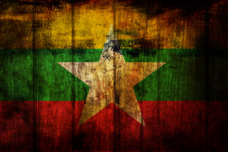 Burma Flag painted on wood background の写真素材