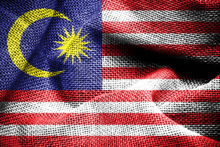 Texture of sackcloth with the image of the Malaysia flag の写真素材