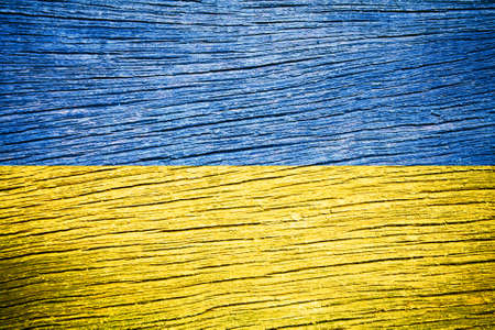 Ukraine flag on old wood texture の写真素材