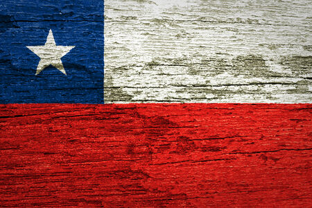 Chile Flag painted on old wood background の写真素材