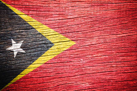 East Timor Flag painted on old wood background の写真素材