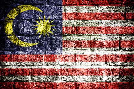 Malaysia flag painted on grunge wall の写真素材