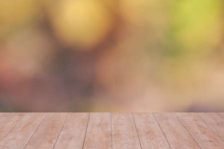 Wood table top on color abstract blurred background. ready for product display
