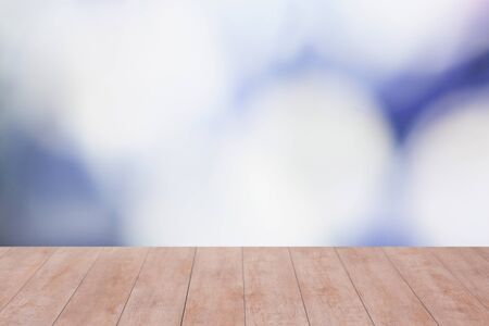 Wood table top on blurred blue bokeh background. ready for product display