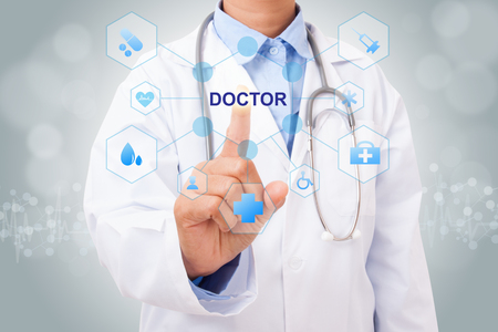 Doctor hand touching DOCTOR sign on virtual screen. medical conceptの写真素材