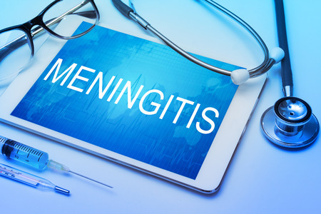 Meningitis word on tablet screen with medical equipment on backgroundの写真素材
