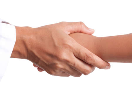 Doctor holding patient's hand, isolated on white backgroundの写真素材