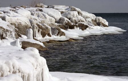 on an icy winter morning on the shores of lake ontarioの写真素材