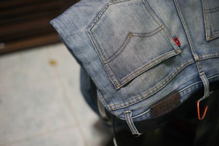 Jeans leaning on the fan, blur background