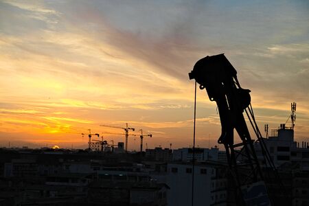 Crane with sunrise in Bangkokの写真素材