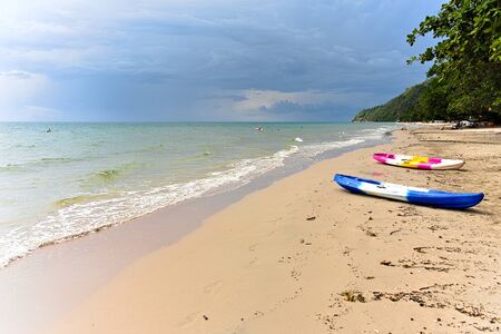 small kayak boats on the beach against the skyの写真素材