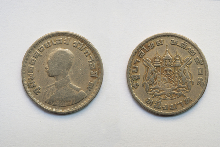 Old Thai coin on white background, 1 baht, B.E. 2505の写真素材