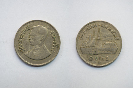 Old Thai coin on white background, 1 baht, B.E. 2525の写真素材