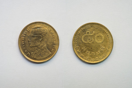 Old Thai coin on white background, 50 satang, B.E. 2523の写真素材