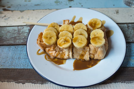 Caramel banana toast on white dishの写真素材