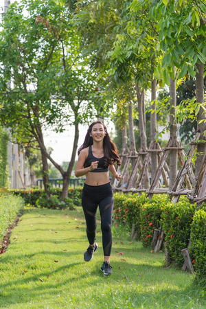 woman exercise by jogging at the park, health conceptの写真素材