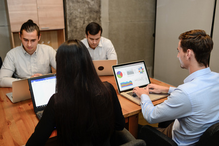 Business people sit on the chair at the office working with laptop.の写真素材
