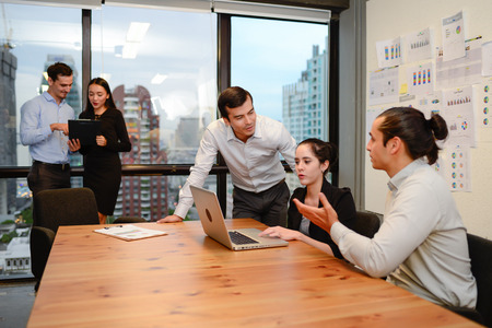 business people discussing ideas at business meeting in officeの写真素材