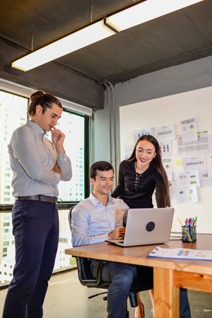businessman and businesswoman discussing ideas at business meeting in officeの写真素材