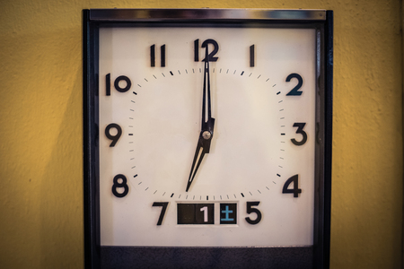 old vintage clock on yellow backgroundの写真素材