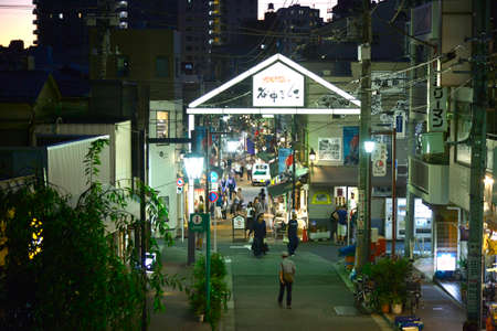 Tokyo, Japan - October 4, 2019 : Traveler walking on Yanaka Ginza shopping street at night, it's old town famous for a cat.のeditorial素材