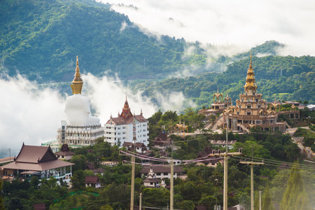 Phetchabun Province, Thailand - September 3, 2017: Big White Buddha statues sitting at Wat Pha Sorn Kaew Temple or Wat Phra Thart Pha Kaew Temple in Khao Kho, Thailand. One of the most popular landmark in Thailand.のeditorial素材