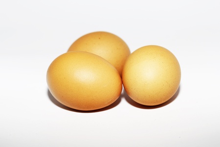 Brown eggs isolated on white backgroundの写真素材