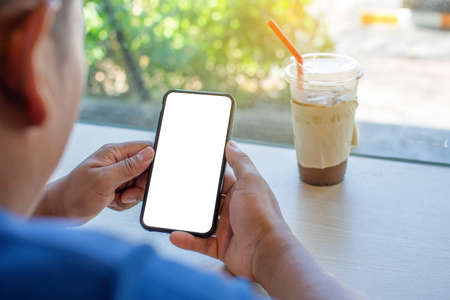 Men are using smart in cafes Mobile phone blank screen for graphic display editing