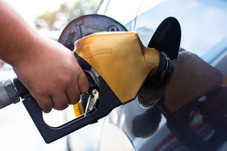People who refuel at a gas station - refueling the machine A car fills up with gas at a gas stationの写真素材